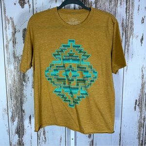 Crazy Train, Golden Tee with Teal Geometric Design. Size Medium. Excellent cond!